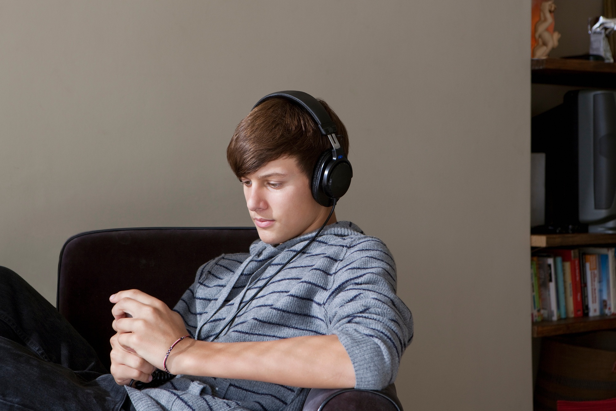 Teenage boy listening to headphones